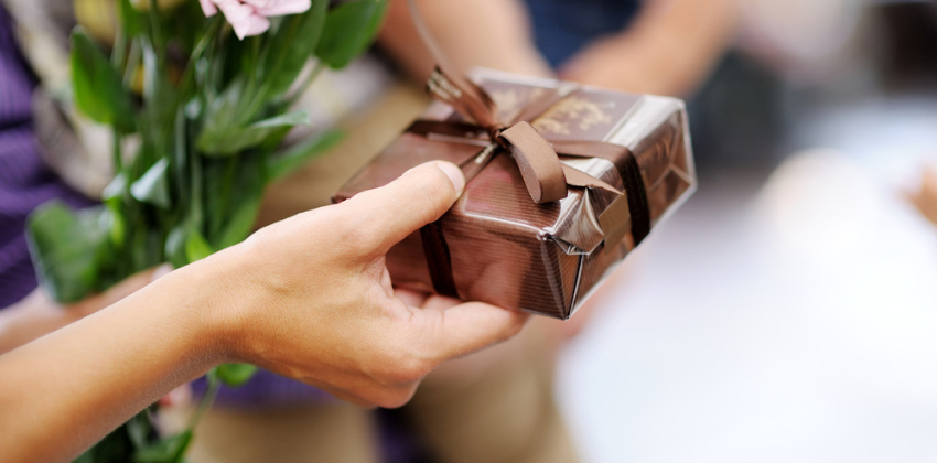 Gift box being handed over